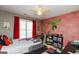 Themed bedroom with carpet, natural light, ceiling fan, and bold decor at 190 Country Club Dr, Hiram, GA 30141