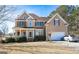 Spacious two-story home with manicured lawn, featuring a two-car garage and traditional architecture at 190 Country Club Dr, Hiram, GA 30141