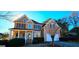 Charming two-story home featuring a blend of stone and siding, complemented by a well-manicured front yard at 190 Country Club Dr, Hiram, GA 30141