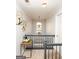 Hallway with carpet floors, white walls, black railing, and decorative lighting fixture at 190 Country Club Dr, Hiram, GA 30141