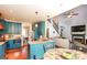 Stylish kitchen with blue cabinets, stainless steel appliances, and a view of the adjacent dining and living spaces at 190 Country Club Dr, Hiram, GA 30141