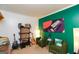 Cozy seating area with vibrant green accent wall, featuring comfortable armchairs and a musical instrument display at 190 Country Club Dr, Hiram, GA 30141