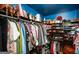 Organized walk-in closet featuring tiered shelving, hanging rods, and a variety of storage solutions at 190 Country Club Dr, Hiram, GA 30141