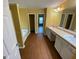 Bathroom boasting dual sinks, a soaking tub, and luxury vinyl flooring at 1472 Queenie Smith Ne Rd, Conyers, GA 30012