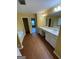 Bathroom boasting dual sinks, a soaking tub, and luxury vinyl flooring at 1472 Queenie Smith Ne Rd, Conyers, GA 30012