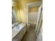 Bathroom featuring a single sink vanity and a view of the toilet and shower/tub at 1472 Queenie Smith Ne Rd, Conyers, GA 30012