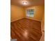 Bedroom with a window, hardwood floors, and neutral paint at 1472 Queenie Smith Ne Rd, Conyers, GA 30012