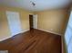 Bedroom with hardwood floors and natural light from the windows at 1472 Queenie Smith Ne Rd, Conyers, GA 30012