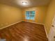 Bedroom featuring wood look floors, natural light, and neutral paint at 1472 Queenie Smith Ne Rd, Conyers, GA 30012