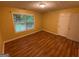 Bedroom featuring hardwood floors, neutral paint, and natural light at 1472 Queenie Smith Ne Rd, Conyers, GA 30012