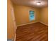 Well-lit bedroom featuring a window, neutral paint and hardwood floors at 1472 Queenie Smith Ne Rd, Conyers, GA 30012