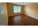 Bedroom featuring wood look floors, neutral paint, and natural light at 1472 Queenie Smith Ne Rd, Conyers, GA 30012