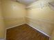 Unfinished walk-in closet featuring rod and wire shelving at 1472 Queenie Smith Ne Rd, Conyers, GA 30012
