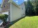 Exterior of home with combination brick and siding and green grass at 1472 Queenie Smith Ne Rd, Conyers, GA 30012