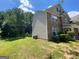 Exterior view of home featuring brick and vinyl siding and green grass at 1472 Queenie Smith Ne Rd, Conyers, GA 30012