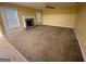 Comfortable living room featuring a stone fireplace and carpet flooring at 1472 Queenie Smith Ne Rd, Conyers, GA 30012