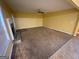 Spacious living room with a fireplace, carpet flooring and a ceiling fan at 1472 Queenie Smith Ne Rd, Conyers, GA 30012