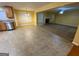 The combined kitchen and living room features tile flooring, fireplace, and modern stainless steel appliances at 1472 Queenie Smith Ne Rd, Conyers, GA 30012