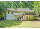 Back exterior with a deck, staircase, and walkout basement door at 419 Jeffery Dr, Locust Grove, GA 30248