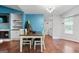 Charming dining area with a wooden table, fireplace, and access to laundry area at 419 Jeffery Dr, Locust Grove, GA 30248
