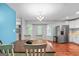 Cozy dining area with a wooden table, chandelier, and view of the laundry area at 419 Jeffery Dr, Locust Grove, GA 30248