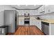 Well-lit kitchen with stainless steel appliances and ample cabinet space at 419 Jeffery Dr, Locust Grove, GA 30248