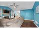 Bright living room with fireplace, wood floors, and dining area in view at 419 Jeffery Dr, Locust Grove, GA 30248