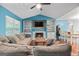 Inviting living room featuring a fireplace, built-in shelving, and comfortable seating at 419 Jeffery Dr, Locust Grove, GA 30248