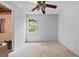 Unfinished room with a ceiling fan and a window for natural light at 419 Jeffery Dr, Locust Grove, GA 30248