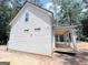 Exterior of the home featuring vinyl siding and a covered porch perfect for relaxing outdoors at 485 West Ave, Bowdon, GA 30108
