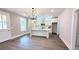 Open kitchen with white cabinets, island, and stainless steel appliances, perfect for cooking and entertaining at 485 West Ave, Bowdon, GA 30108