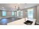 Bright living room with hardwood floors and many windows that let in lots of natural light at 485 West Ave, Bowdon, GA 30108