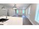 Spacious living room open to the kitchen, featuring hardwood floors and great natural light at 485 West Ave, Bowdon, GA 30108
