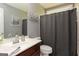 Bathroom features a single sink vanity and a shower and tub combination at 1252 Heritage Dr, Villa Rica, GA 30180