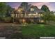 Expansive backyard view with a screened porch, deck, and lush greenery at 914 Champions Way, Mcdonough, GA 30252