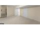Finished basement featuring plush carpets, stairs, and multiple entry ways at 914 Champions Way, Mcdonough, GA 30252