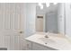 Powder blue bathroom featuring a vanity, sink, toilet, and mirror at 914 Champions Way, Mcdonough, GA 30252