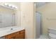 Bathroom with a toilet and shower covered by a curtain at 914 Champions Way, Mcdonough, GA 30252
