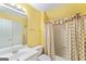Bright bathroom featuring a vanity, toilet, and shower/tub combination at 914 Champions Way, Mcdonough, GA 30252