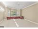 Bright bedroom with large windows and custom window bench at 914 Champions Way, Mcdonough, GA 30252
