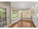Bright breakfast nook with window seat, hardwood floors and large windows at 914 Champions Way, Mcdonough, GA 30252