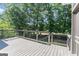 Beautiful outdoor deck overlooking a lush green yard, perfect for entertaining and relaxing at 914 Champions Way, Mcdonough, GA 30252