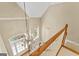 Bright foyer with a chandelier, hardwood floors, and staircase at 914 Champions Way, Mcdonough, GA 30252