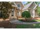 Close up of the home's entryway featuring stone facade and a well-manicured lawn at 914 Champions Way, Mcdonough, GA 30252