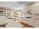 Bright kitchen with stainless appliances, white cabinetry, and breakfast bar at 914 Champions Way, Mcdonough, GA 30252