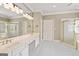 Bright bathroom features double vanity, shower and separate soaking tub at 914 Champions Way, Mcdonough, GA 30252