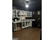 Unique kitchen featuring contrasting black walls and white cabinets, providing a modern and eye-catching design at 4619 S Seminole Dr, Douglasville, GA 30135