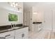 Bathroom featuring double vanities with granite countertops and tile flooring at 107 Edgewater Way, Peachtree City, GA 30269