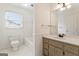 Bright bathroom featuring a bathtub and white-painted cabinets with a contrasting countertop at 107 Edgewater Way, Peachtree City, GA 30269