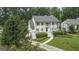Traditional-style home with well-manicured landscaping and a symmetrical front facade at 107 Edgewater Way, Peachtree City, GA 30269